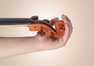 Violin in palm close up